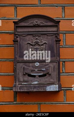 Old vintage mailbox on brick wall Stock Photo