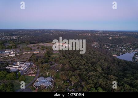 Aerial view of Woronora Cemetery and Sutherland suburb surrounded by lush greenery, Sydney, NSW, Australia Stock Photo