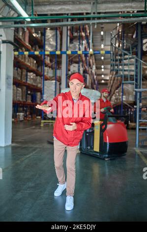 Focused middle-aged supervisor working in the warehouse Stock Photo