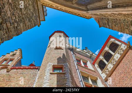 Bruges, Belgium , upward view of the Cruuthusemuseum palace in the courtyard of the Church of Our lady Stock Photo