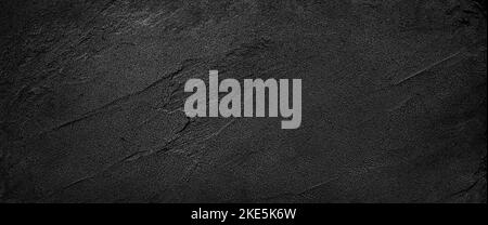 Black or dark gray rough grainy sand texture background Stock Photo