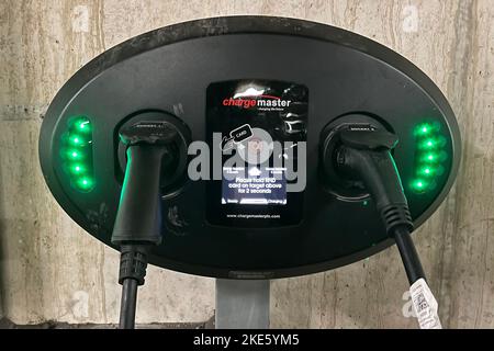 Electric car charging point in a underground supermarket. UK. LONDON. November 2022. Stock Photo