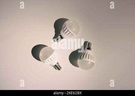 Three LED lights on a white background. Energy saving technology. Low angle of illumination. Stock Photo