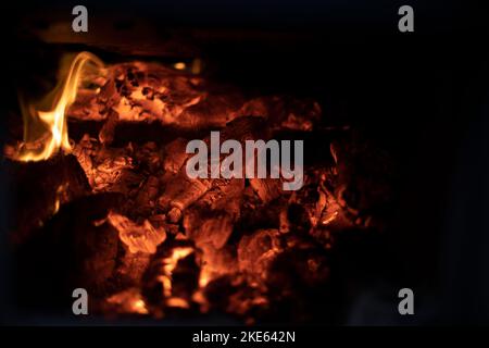 Fire in hearth. Flame texture. Burning coals. High temperature. Stock Photo