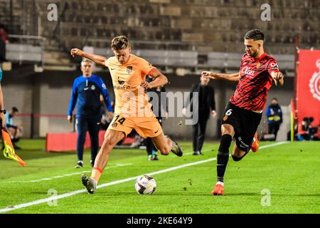 MALLORCA, SPAIN - NOVEMBER 9: Marcos Llorente of Atletico de Madrid and Jose Copete of RCD Mallorca fight for the ball during the match between RCD Mallorca and Atletico de Madrid of La Liga Santander on November 9, 2022 at Visit Mallorca Stadium Son Moix in Mallorca, Spain. (Photo by Samuel Carreño/ PX Images) Stock Photo