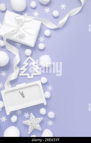 Christmas pattern. Gifts, clocks, snow, balls, white on a purple pastel background Christmas, winter, new year minimal concept. Flat lay, top view, co Stock Photo