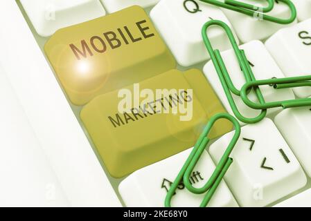 Hand writing sign Mobile Marketing. Word for advertising that promotes products via adaptable devices Stock Photo