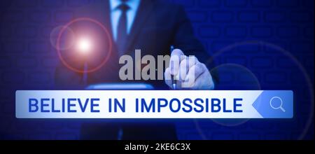 Conceptual caption Believe In Impossible. Business approach motivation and inspiration that you can make it happen Stock Photo