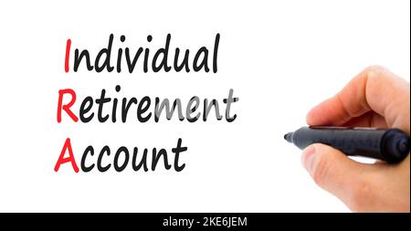 IRA individual retirement account symbol. Concept words IRA individual retirement account on beautiful white background. Businessman hand Business IRA Stock Photo