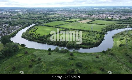 An aerial shot of the River Mersey in Warrington, Cheshire with Paddington Meadows behind Stock Photo