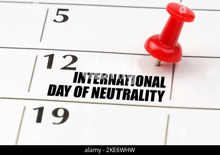 Holidays. On the calendar grid, the date and name of the holiday - International Day of Neutrality Stock Photo