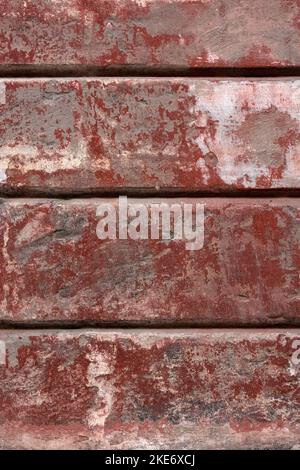 BACKGROUND TEXTURE - Old red painted wall with peeling paint Stock Photo