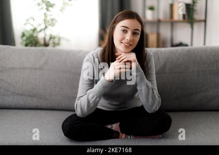 Woman resting on couch Stock Photo