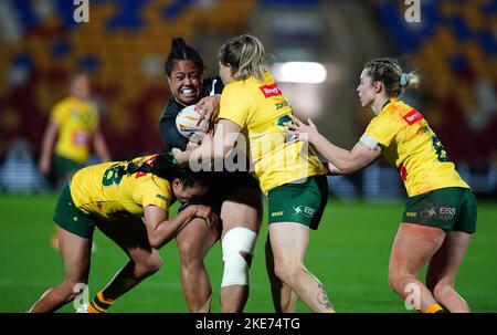 New Zealand's Annetta Nu'uausala is tackled by Australia's Emma Tonegato (right), Yasmin Clydesdale (left) and Caitlan Johnston during the Women's Rugby League World Cup Group B match at the LNER Community Stadium, York. Picture date: Thursday November 10, 2022. Stock Photo