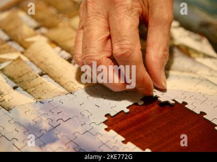 Slotting the next piece of the jigsaw into place Stock Photo