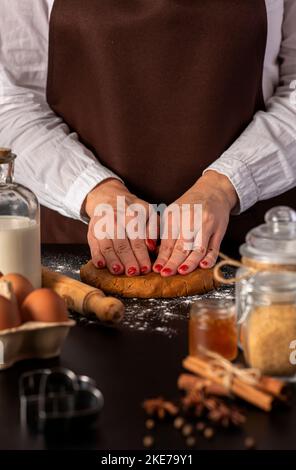 Food photography of  ingredients for gingerbread,  dough, woman, cookies, biscuits, cooking, preparation, cinnamon, anise Stock Photo