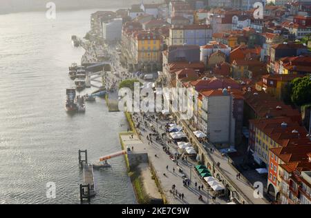 Porto Portugal, the Ribeira promenade with tourists and historical buildings Stock Photo