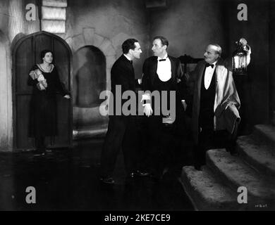 SYBIL JANE as Mrs. Barrymore JOHN STUART as Sir Henry Baskerville HENRY HALLATT as Barrymore and FREDERICK LLOYD as Dr. Watson in THE HOUND OF THE BASKERVILLES 1931 director GARETH GUNDRY screenplay Edgar Wallace producer Michael Balcon A Gainsborough Picture / Ideal Films Stock Photo