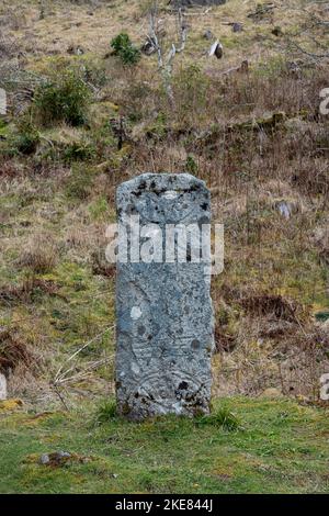 Pictish stone with distinct symbols carved on front face standing on ground, known to be a type of monumental stela, Isle of Raasay, Scotland, UK Stock Photo