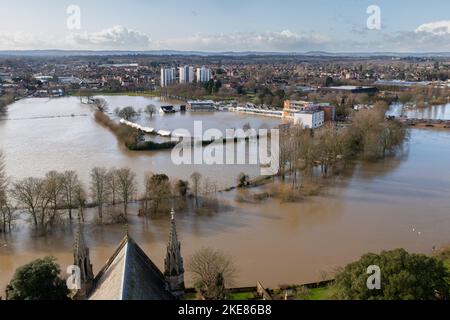 The River Severn in the foreground bursts its banks to flood Worcester Cricket Club and surrounding areas. Stock Photo