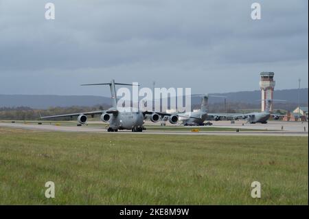 A C-17 Globemaster III aircraft is maneuvered on the taxiway at the 167th Airlift Wing, Martinsburg, West Virginia, Nov. 5, 2022 as part of  the 167th Operations Group Rodeo. The aircraft was reversed to a specific point on the flight line, one of several skills evaluated during the  rodeo. (U.S. Air National Guard photo by Staff Sgt. Timothy Sencindiver) Stock Photo