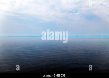 Foggy; misty view of Cook Inlet from Kenai Peninsula; Lake Clark National Park & Preserve beyond; Alaska; USA Stock Photo