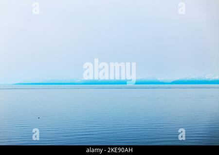 Foggy; misty view of Cook Inlet from Kenai Peninsula; Lake Clark National Park & Preserve beyond; Alaska; USA Stock Photo