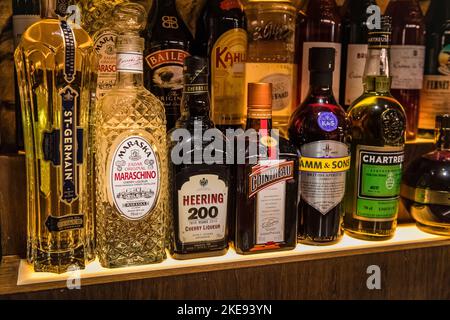 Collection of bottles on shelves Stock Photo