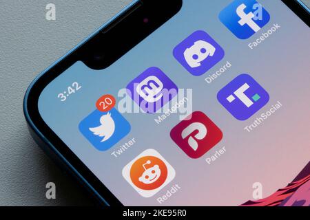 App icons of Twitter and some of its alternatives, including Mastodon, Discord, Facebook, Reddit, Parler, and Truth Social, are seen on an iPhone. Stock Photo