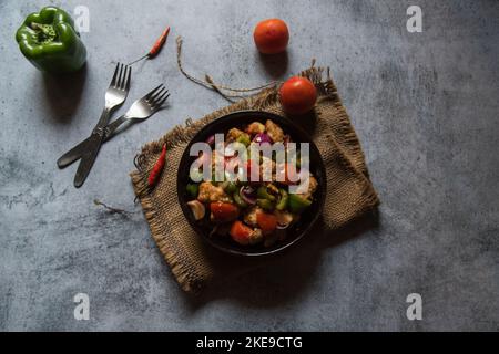 Top view of stir fried chicken served in a bowl. Stock Photo