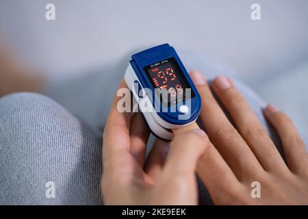 African Hand Pulse Heart Rate And Oximeter Stock Photo