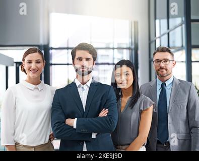 Were the team you need. Cropped portrait of a group of businesspeople standing in the office. Stock Photo