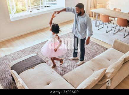 Man, father or girl ballet dancing in living room of house or happy family home in energy, ballerina tutu or dress in top view. Dad, child or dancer Stock Photo