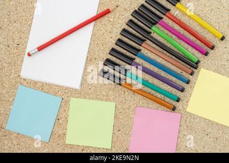 Colorful markers and blank sticky notes Stock Photo