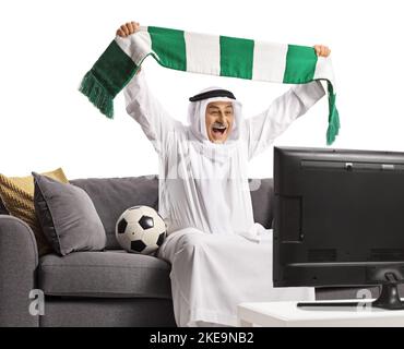 Happy mature arab man with a soccer ball cheering isolated on white ...