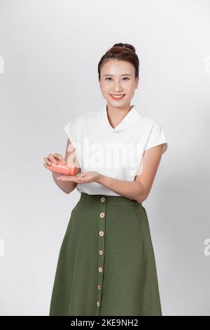 Happy Asian Woman Pouring Pills From Bottle Stock Photo