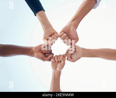 Fist bump, support and trust in team with team building motivation and success together. Hands, fist and teamwork, community with collaboration and Stock Photo