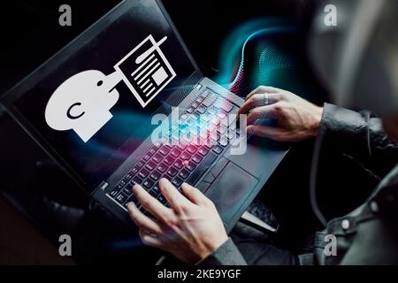 Man reading fake news on laptop Stock Photo