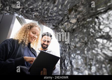 Young technicians using digital tablet Stock Photo