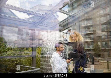 Technicians using digital tablet at work Stock Photo