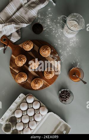 Cupcakes on wooden board Stock Photo