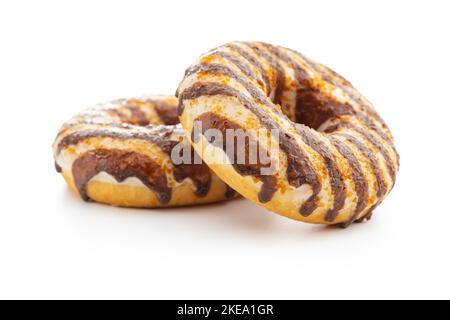 Donuts with chocolate and caramel icing isolated on the white background. Stock Photo