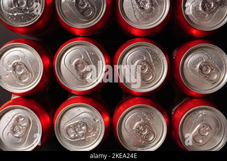 group of fresh beer cans with drops of water with black background Stock Photo