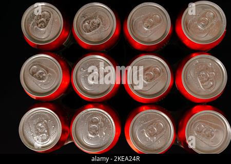 group of fresh beer cans with drops of water with black background Stock Photo