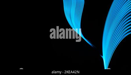 Abstract technology banner design. Digital neon lines on black background with copy space. Stock Photo