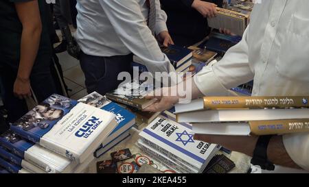 JERUSALEM, ISRAEL - NOVEMBER 10: Far right-wing activists sell books by late Jewish extremist leader Rabbi Meir Kahane, founder of the Kach party during a ceremony honoring him on November 10, 2022 in Jerusalem, Israel. Meir Kahane's party Kach, was barred from running for the Israeli parliament as the result of the extremist views the party promoted against Arabs. The United States, also outlawed the Kach movement and categorized it as a terrorist organization. Credit: Eddie Gerald/Alamy Live News Stock Photo