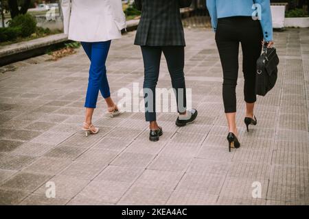 Three business people walking Stock Photo