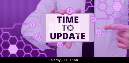 Hand writing sign Time To Update. Word Written on System software update for enhancement or compatibility Stock Photo