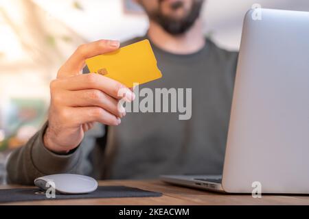 Hands holding credit card and using laptop Online shopping concept Stock Photo