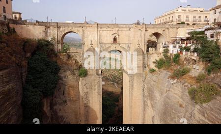 Aerial drone view of New Bridge in Ronda. White villages in the province of Malaga, Andalusia, Spain. Beautiful village on the cliff of the mountain. Stock Photo